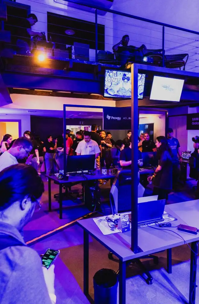 Thrilling gaming convention featuring technology displays and interactive entertainment under dramatic purple lighting.